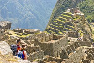 Couple looks out over Machu Picchu