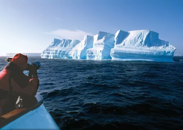 Photograph the blue waters reflecting off the glacial formations