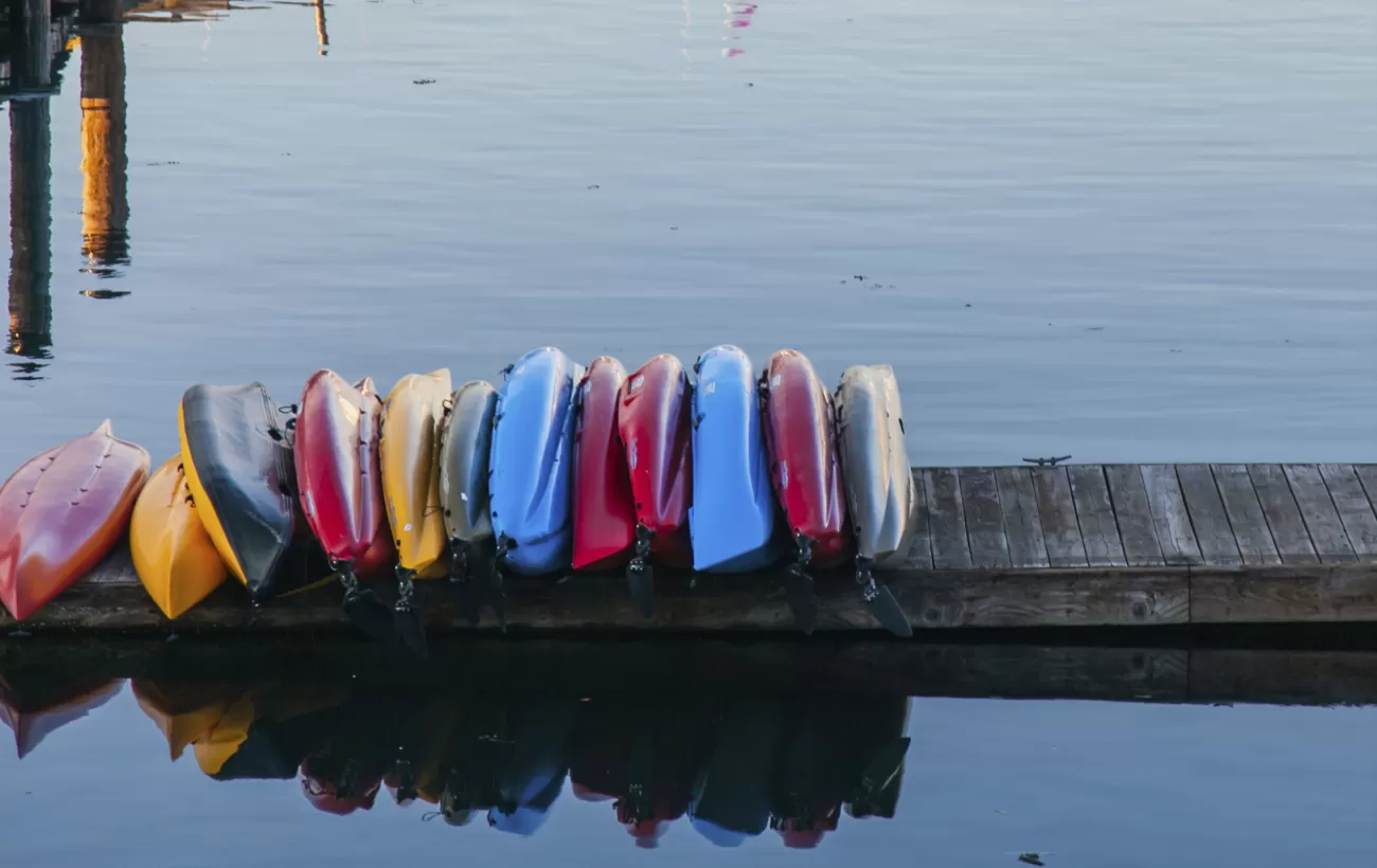 Colorful kayaks line the docks of coastal Washington