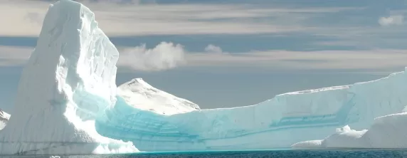An iceburg curves with the horizon
