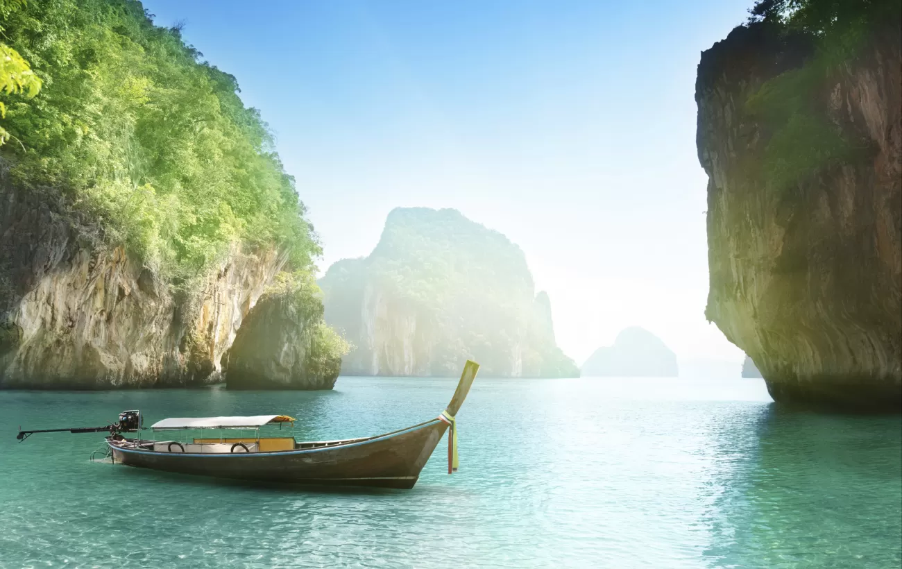 Long-tailed boat on beach of island in Krabi Province