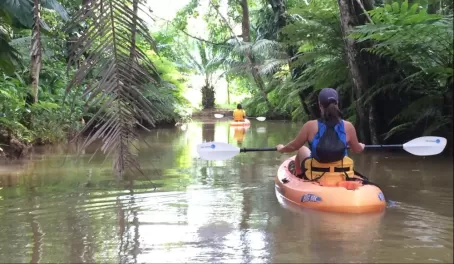 Lynessa kayaks in the jungle