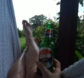 relaxing with a beer in the hammock outside our cabin