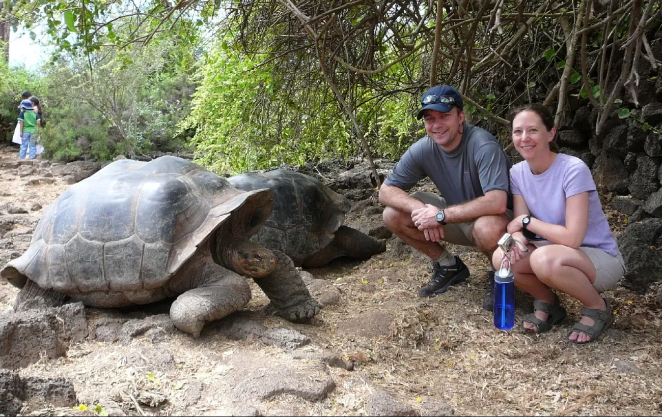 With our favorite tortoise in the Galapagos