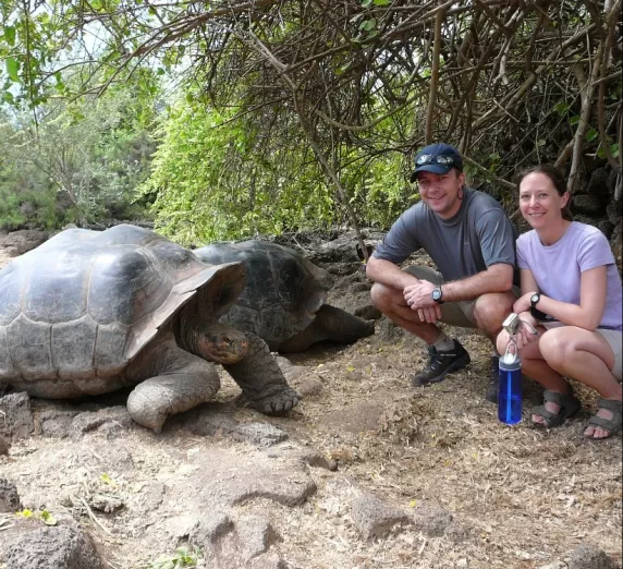 With our favorite tortoise in the Galapagos