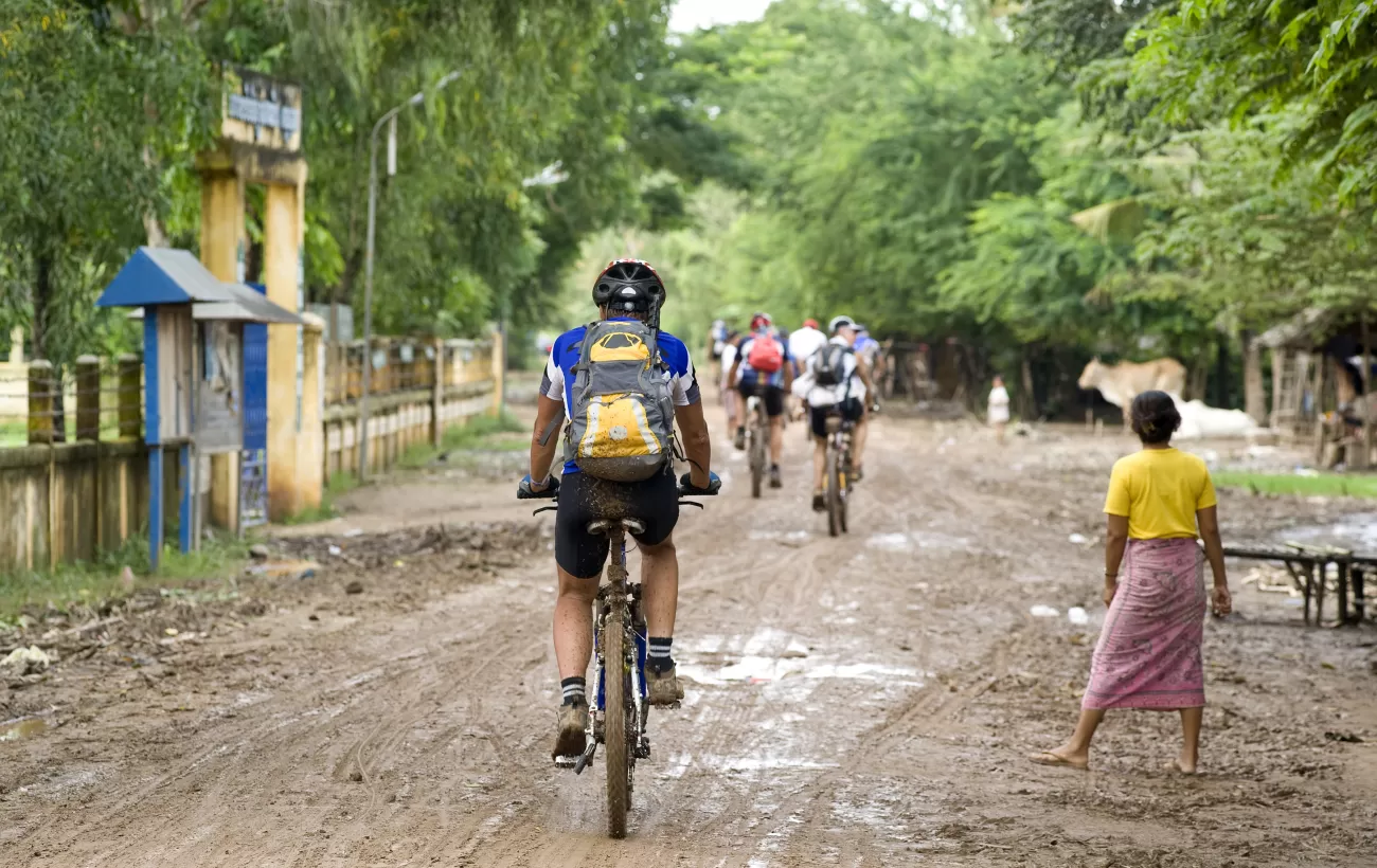 Biking through a village in Cambodia