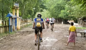 Biking through a village in Cambodia