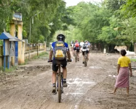 Biking through a village in Cambodia